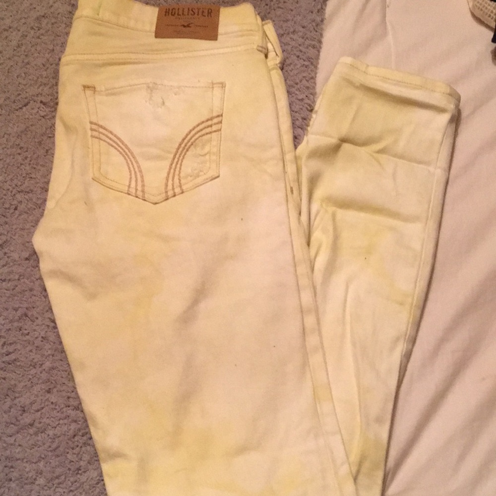 White and yellow acid wash distressed jeans